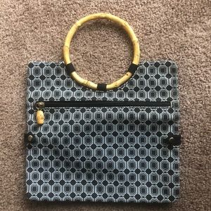 Handbag or clutch with bamboo style handle